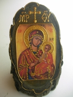 Icon St. Mary on wood stump