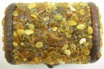 Box for jewelry encrusted with natural amber