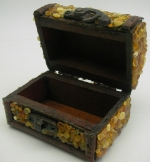 Box for jewelry encrusted with natural amber