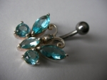 Silver navel piercing